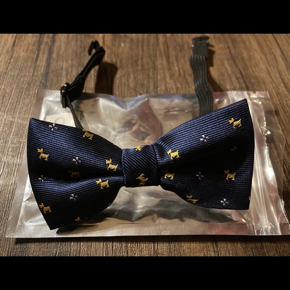 Carahere child's handmade bowtie with dog pattern